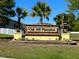 Decorative entrance sign for Oak Hill Plantation with manicured landscaping at 3106 Ne 46Th Ave, Ocala, FL 34470