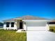 Charming single-story home with a well-manicured lawn and attached two-car garage, perfect for suburban living at 3106 Ne 46Th Ave, Ocala, FL 34470