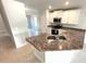 Stylish kitchen featuring granite countertops, stainless steel sink and appliances, and ample cabinet space at 3106 Ne 46Th Ave, Ocala, FL 34470