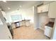 Modern kitchen featuring stainless steel appliances, granite countertops, and open layout to the living area at 3106 Ne 46Th Ave, Ocala, FL 34470