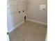 A laundry room with tile floors and shelving at 3106 Ne 46Th Ave, Ocala, FL 34470