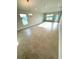 Spacious living room featuring tile flooring, recessed lighting, and large windows offering bright natural light at 3106 Ne 46Th Ave, Ocala, FL 34470