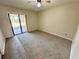 The bedroom has carpet and sliding glass doors leading to a screened porch at 3457 Sw 18Th Pl, Ocala, FL 34474