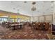 Spacious, versatile event space with chandeliers, tables, and elegant decor at 5162 Harbour Dr, Oxford, FL 34484