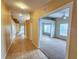 Bright hallway with tile flooring, leading to bedrooms and other rooms at 5162 Harbour Dr, Oxford, FL 34484