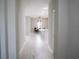 Hallway with view of modern living space and dining area featuring lovely floors at 8565 Sw 125Th Court Rd, Dunnellon, FL 34432