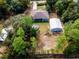 Expansive property featuring a backyard with a large detached garage and a unique round above-ground pool at 12805 Sw 64Th Ln, Ocala, FL 34481