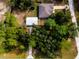 Aerial view showing house, detached garage, and surrounding trees at 12805 Sw 64Th Ln, Ocala, FL 34481