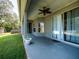 Covered back patio with sliding glass doors and ceiling fan at 12805 Sw 64Th Ln, Ocala, FL 34481