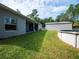 Expansive backyard featuring lush green grass, an above ground pool and a shed at 12805 Sw 64Th Ln, Ocala, FL 34481