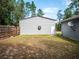 View of the metal storage building in the backyard, adjacent to the main home at 12805 Sw 64Th Ln, Ocala, FL 34481