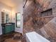 Bathroom with tiled shower/tub combo and green vanity at 12805 Sw 64Th Ln, Ocala, FL 34481