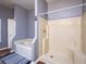Bathroom with tub and shower, tile floors at 12805 Sw 64Th Ln, Ocala, FL 34481