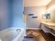 Bathroom with soaking tub, shower, and updated vanity at 12805 Sw 64Th Ln, Ocala, FL 34481