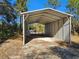 Carport on a wooded property with mature trees and landscaping at 12805 Sw 64Th Ln, Ocala, FL 34481