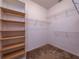 Walk-in closet with multiple shelving and railing options for organized storage at 12805 Sw 64Th Ln, Ocala, FL 34481