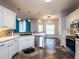 Open concept kitchen with stainless steel appliances and ample counter space at 12805 Sw 64Th Ln, Ocala, FL 34481