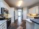 Bright kitchen featuring white cabinets and tile flooring at 12805 Sw 64Th Ln, Ocala, FL 34481