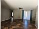 Spacious living room with tile floors and access to backyard at 12805 Sw 64Th Ln, Ocala, FL 34481