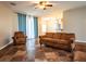 Spacious living room featuring tile flooring, neutral walls, and a ceiling fan at 12805 Sw 64Th Ln, Ocala, FL 34481
