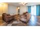 Open living room featuring tile flooring, neutral walls, a ceiling fan, and natural light at 12805 Sw 64Th Ln, Ocala, FL 34481