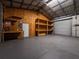 Spacious workshop with built-in shelving and workbench at 12805 Sw 64Th Ln, Ocala, FL 34481