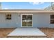 Backyard with a sliding glass door leading to the patio at 15282 Sw 27 Ln, Ocala, FL 34481