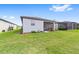 Landscaped backyard with view of house and screened porch at 6014 Sw 93Rd Cir, Ocala, FL 34481