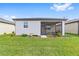 Charming home with a screened patio and well-manicured backyard at 6014 Sw 93Rd Cir, Ocala, FL 34481
