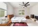 Bright bedroom with a double bed and ceiling fan at 6014 Sw 93Rd Cir, Ocala, FL 34481