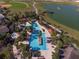 Resort-style pool with multiple pools, a spa, and a large deck at 6014 Sw 93Rd Cir, Ocala, FL 34481