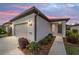 Single-story home with attached garage, landscaping, and walkway at dusk at 6014 Sw 93Rd Cir, Ocala, FL 34481