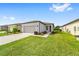 Front view of single story home with grassy yard at 6014 Sw 93Rd Cir, Ocala, FL 34481