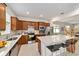 Modern kitchen with an island, stainless steel appliances, and wood cabinets at 6014 Sw 93Rd Cir, Ocala, FL 34481