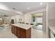 Modern kitchen with an island and sliding glass doors to a patio at 6014 Sw 93Rd Cir, Ocala, FL 34481