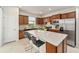 Modern kitchen with an island and stainless steel appliances at 6014 Sw 93Rd Cir, Ocala, FL 34481