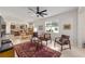 Living room with open floor plan and view into kitchen at 6014 Sw 93Rd Cir, Ocala, FL 34481
