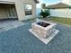 Cozy backyard featuring a brick fire pit, rock landscaping, and mature shrubbery at 10923 Sw 38Th Ave, Ocala, FL 34476