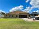 Expansive backyard featuring a well-maintained lawn, a brick paver patio, and a gazebo at 10923 Sw 38Th Ave, Ocala, FL 34476