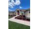 Inviting single-Gathering home with a well-manicured lawn and a pop of color from the front door at 10923 Sw 38Th Ave, Ocala, FL 34476