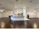 Open-concept kitchen featuring granite counters, stainless steel appliances, and breakfast bar seating at 10923 Sw 38Th Ave, Ocala, FL 34476