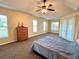 Spacious main bedroom includes tray ceilings and a private patio at 10923 Sw 38Th Ave, Ocala, FL 34476