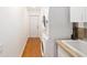 Convenient laundry area with stacked washer/dryer and utility sink at 6042 Topsail Rd, Lady Lake, FL 32159