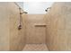 Neutral tiled walk-in shower featuring dual shower heads and a built-in shelf at 6042 Topsail Rd, Lady Lake, FL 32159