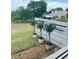 The outside view shows a well kept lawn with an appealing fence and beautiful plants in pots at 6042 Topsail Rd, Lady Lake, FL 32159