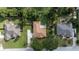 Overhead view of the home showing the roof, driveway, landscaping, and surrounding neighborhood at 10291 Se 42Nd Ter, Belleview, FL 34420