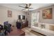 Bedroom with ceiling fan, desk, futon and ample natural light at 10291 Se 42Nd Ter, Belleview, FL 34420