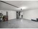 A spacious garage area with a water heater, tools and a refrigerator at 10291 Se 42Nd Ter, Belleview, FL 34420