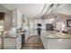 This kitchen is updated with granite counters and modern stainless steel appliances at 10291 Se 42Nd Ter, Belleview, FL 34420