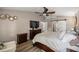 Main bedroom features ceiling fan and access to bathroom at 10291 Se 42Nd Ter, Belleview, FL 34420